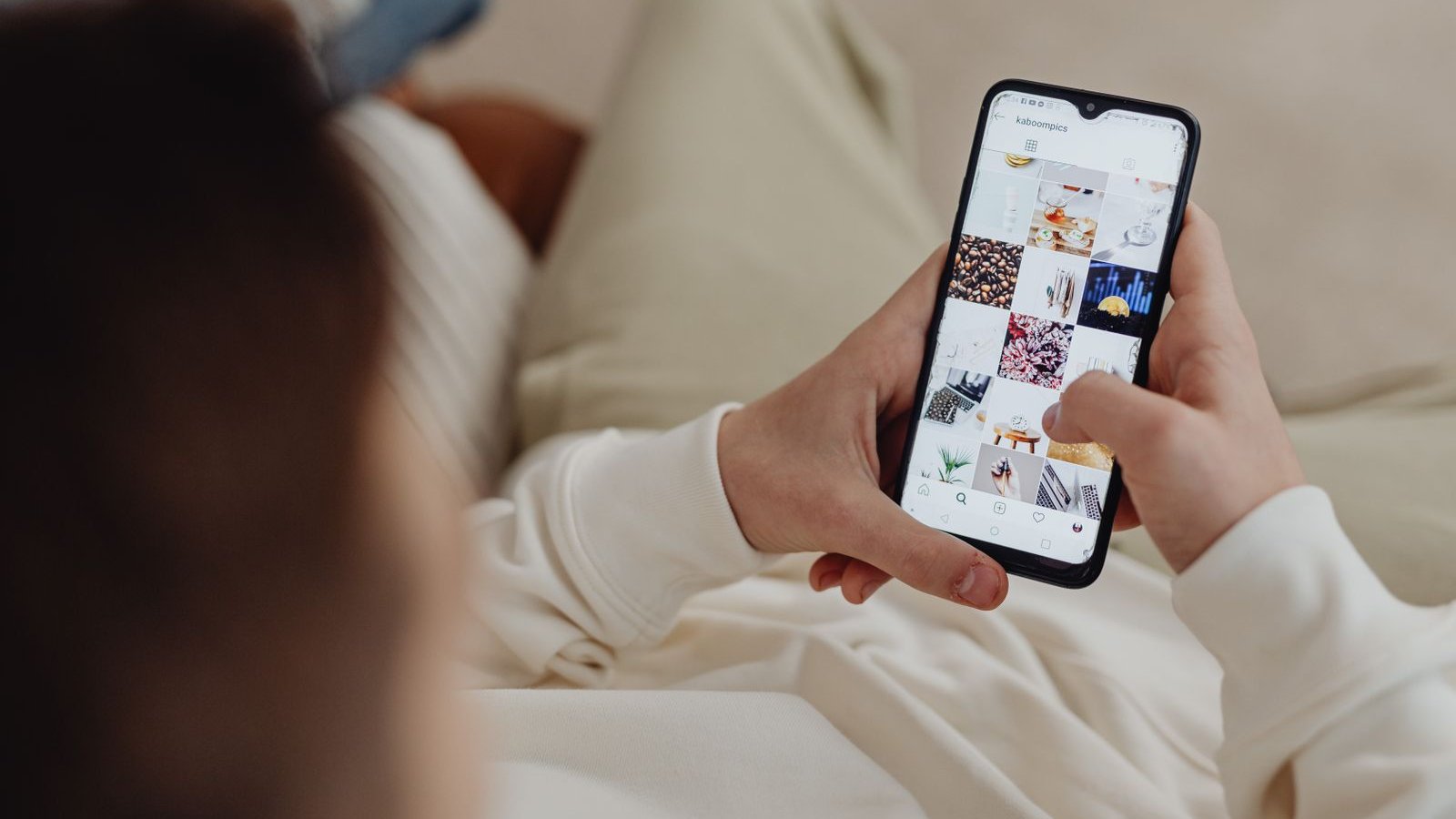Person scrolling through short-form videos on a smartphone