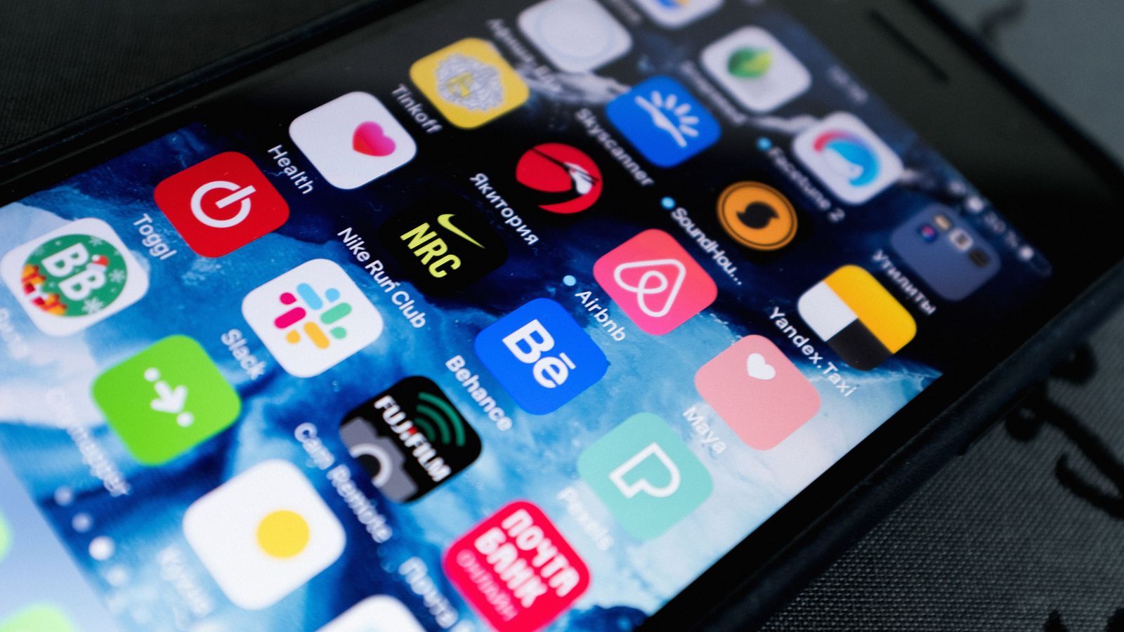 Smartphone displaying multiple social app icons on screen