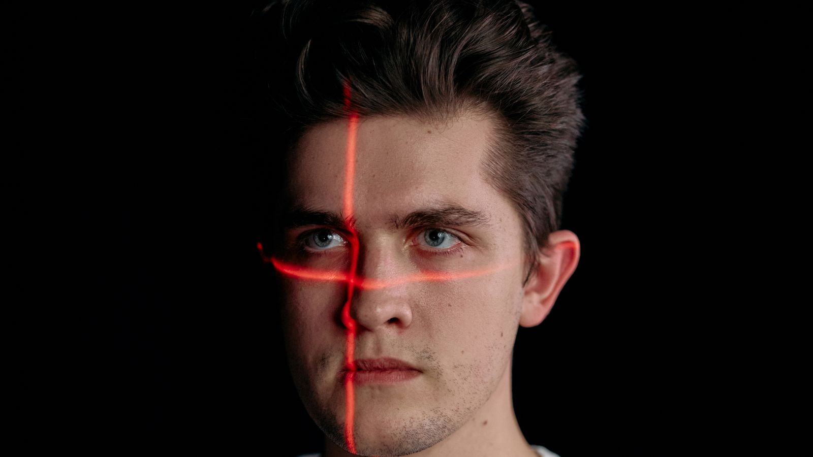 Conceptual portrait with laser scanning lines for facial recognition