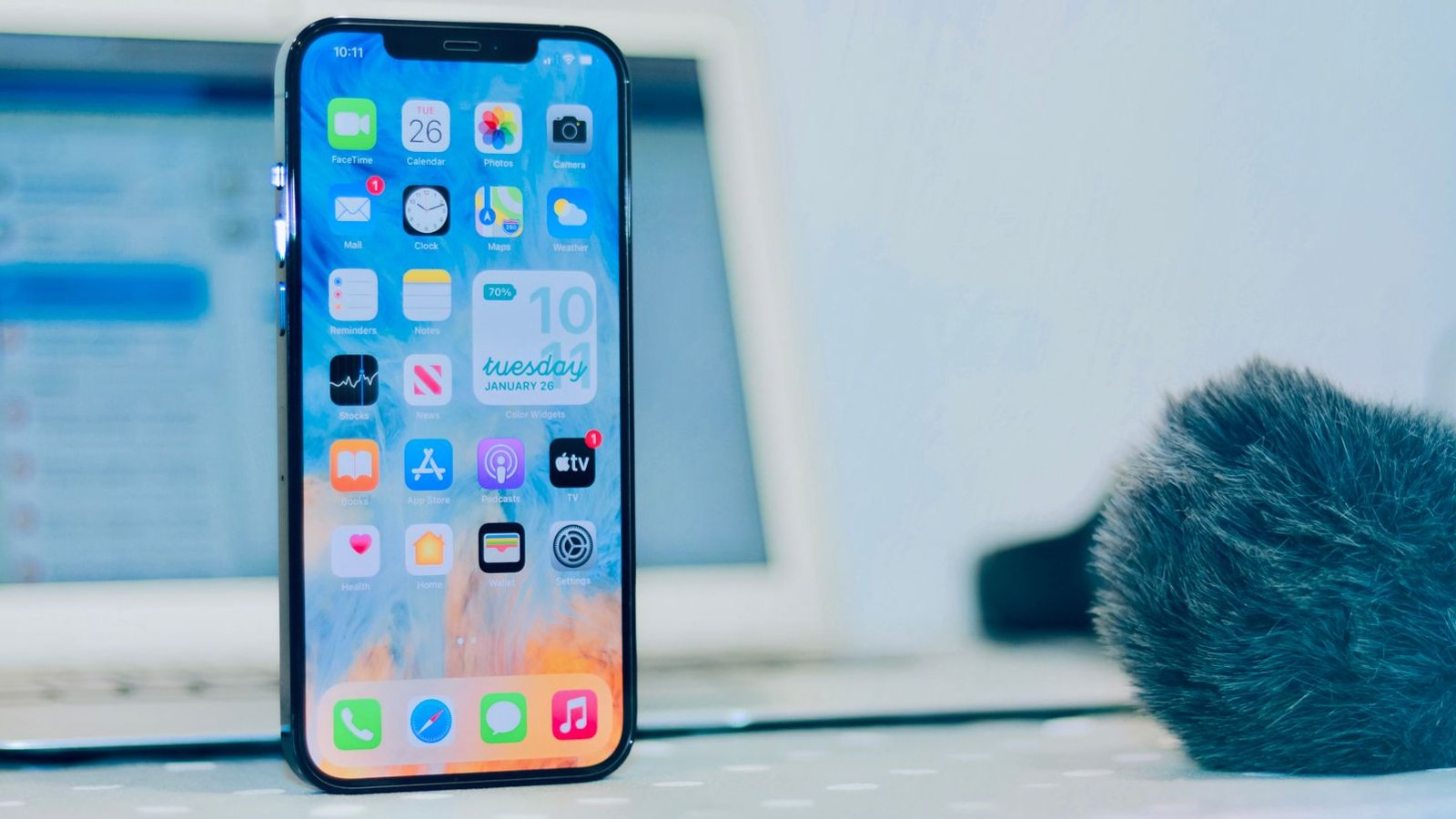Person checking a smartphone screen showing app usage